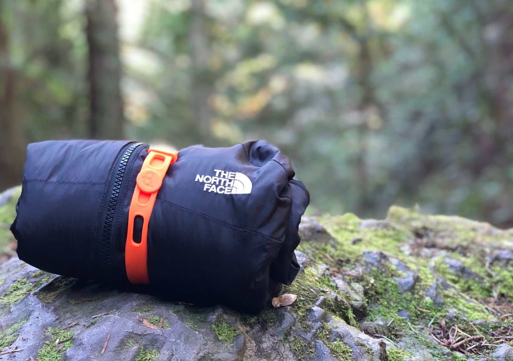 Adventure, Hiking, Camping, Outdoors Rolled jacket secured with a Packband