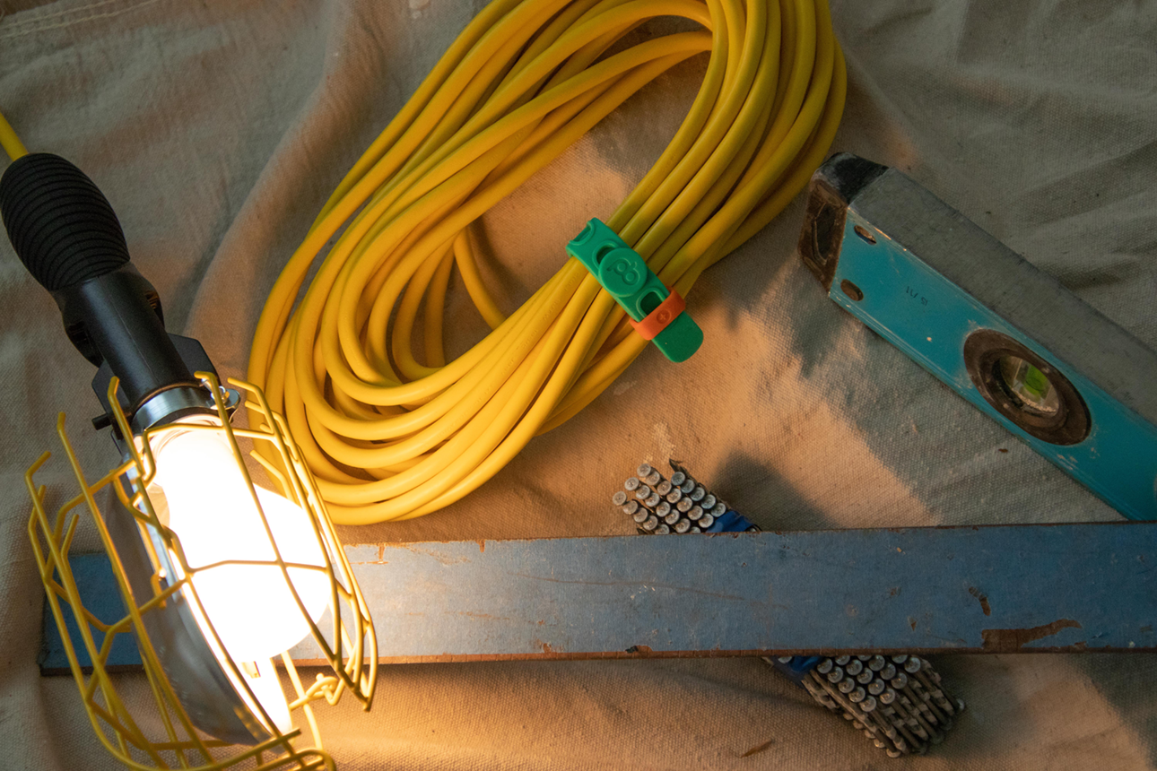 Construction equipment and power tool cord organized with a Packband